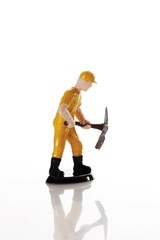Figure of a construction worker with hard hat and pickaxe