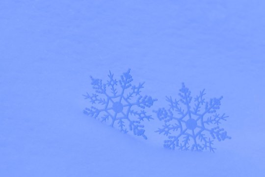 Decorative snowflakes in snow