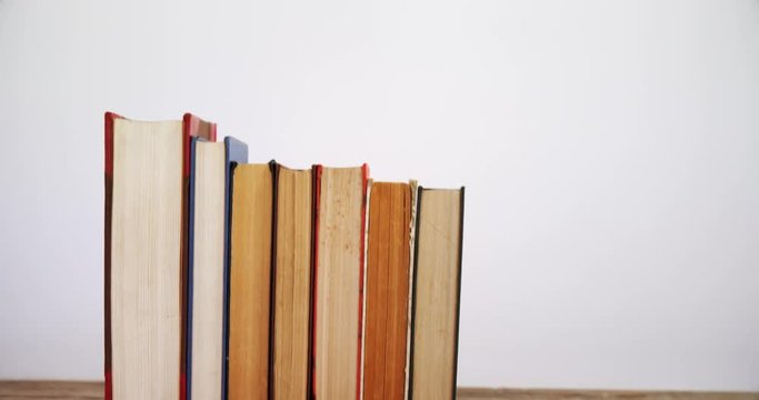 Books arranged on wooden table 