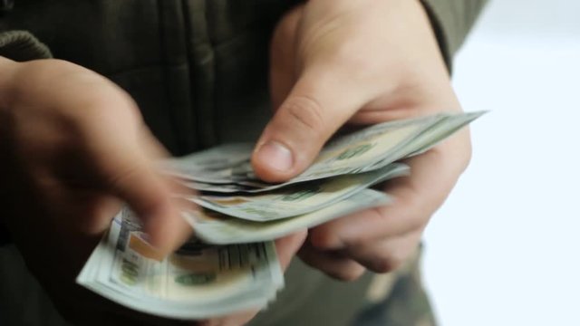 One hundred dollar bills in the hands of man, bulkhead is money