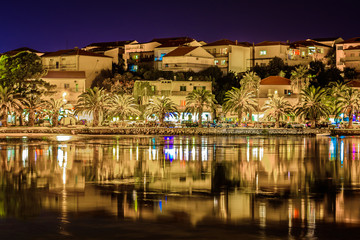 Fototapeta na wymiar Stobrec town night view. / Night waterfront view at small town in suburb of town Split, Stobrec townscape, Croatia.