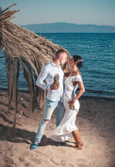 Young couple in love outdoor. Stunning sensual outdoor portrait of young stylish fashion couple...