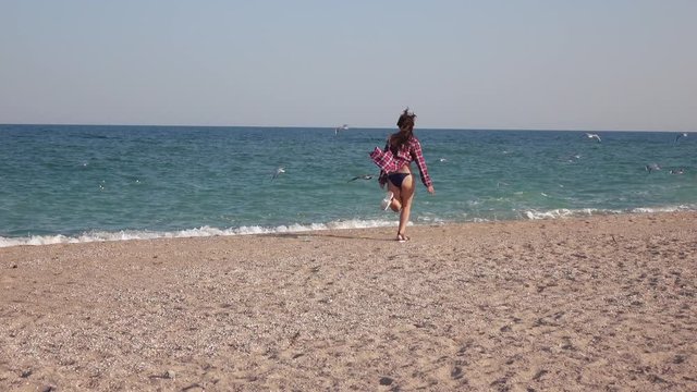 Girl running at sea