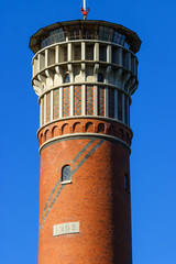 Fototapeta na wymiar Close-up on a lookout tower of brickstone