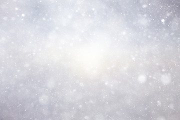 Snowfall texture of snowflakes on blurred background