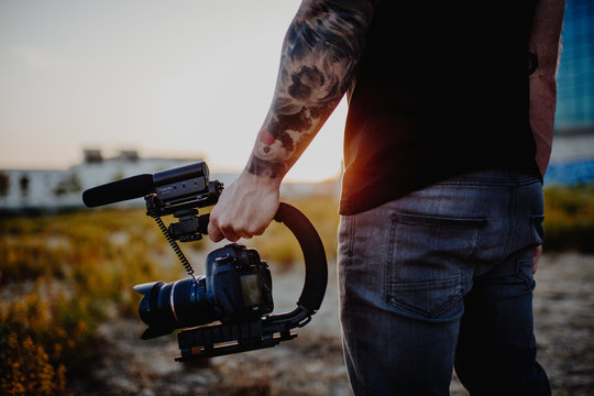 Video camera operator working with his equipment