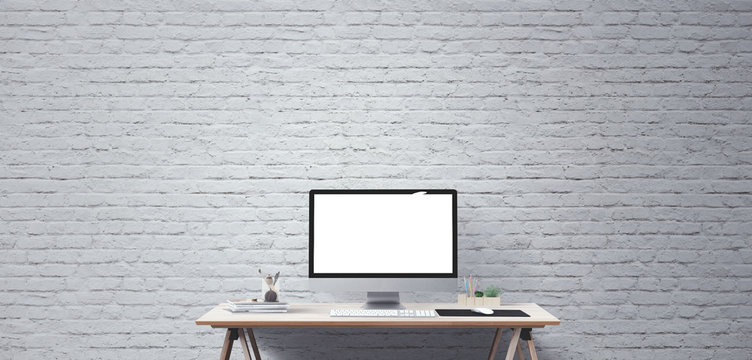 Computer display and office tools on desk. Desktop computer screen isolated. Modern creative workspace background. Front view
