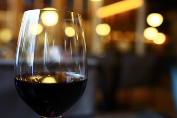Serving a glass of red wine in a restaurant