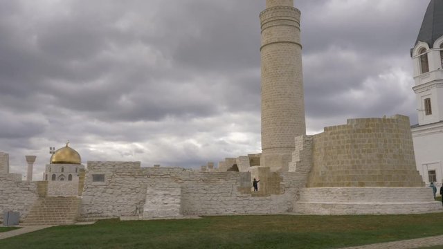 Beige fortress dolly shot handheld. Summer day outdoors.