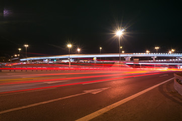 Fototapeta na wymiar Speed motion,abstract background rays.Traffic car lights on road