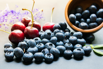 Assorted fresh berries on a wooden background