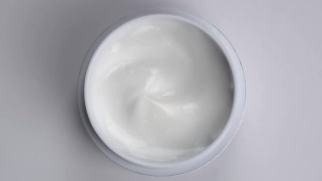 Closeup shot of cosmetics cream with rotate, Top view

