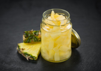 Rustic slate slab with Chopped Pineapple (preserved), selective focus