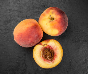 Fototapeta na wymiar Portion of Fresh Peaches, selective focus