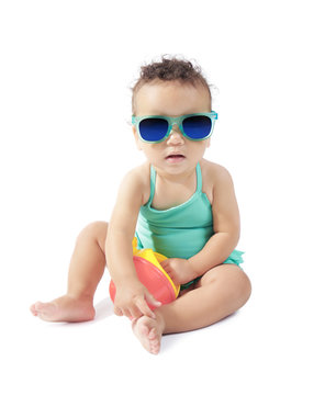 Cute little baby in swimsuit and sunglasses, isolated on white
