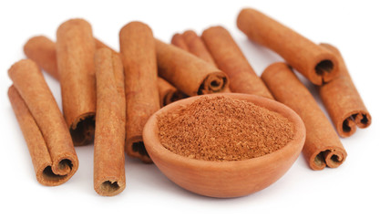 Bunch of some fresh aromatic cinnamon with powder spice