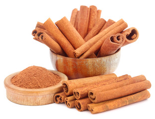 Bunch of some fresh aromatic cinnamon with powder spice