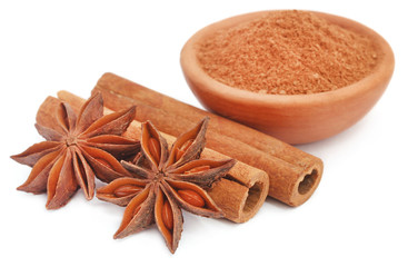 Some aromatic cinnamon with star anise and ground spice in a bowl