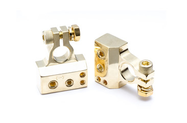 positive and negative metal gold vehicle battery terminal on white background