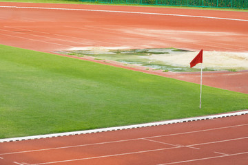 Fototapeta premium Soccer field with red flag on conner