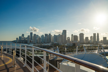 Naklejka premium Miami Skyline and shipping docks from cruise ship with cruise ship board foreground