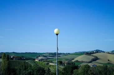 Landscape behind the street lamp (Montecchio, Italy)