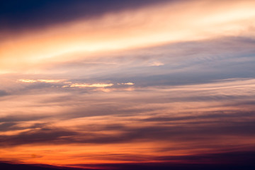 Naklejka na ściany i meble colorful dramatic sky with cloud at sunset.