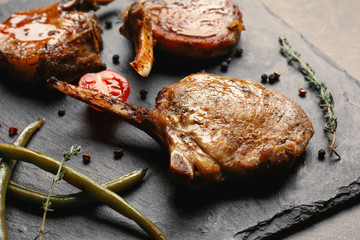 Slate plate with grilled meat, closeup