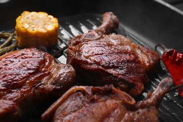 Grill pan with tasty meat, closeup