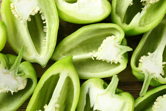 Sliced green peppers as background