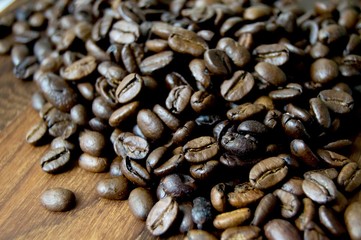 Coffee beans on a wood surface
