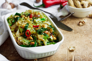 Fried savoy cabbage with peanuts and chili
