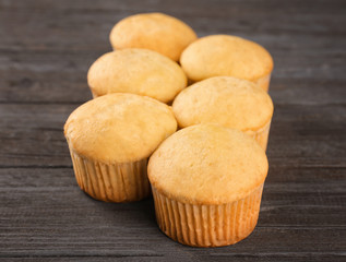 Banana muffins on wooden table, closeup