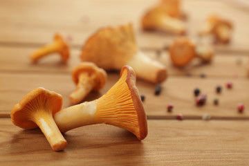 Chanterelles on wooden background