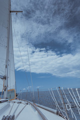 Yachting on sail boat during sunny weather