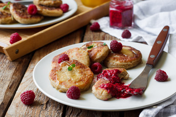cheese pancakes with raspberry sauce