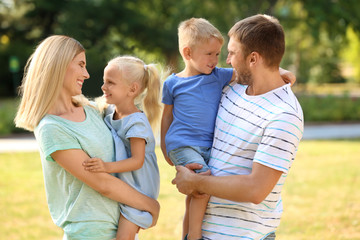 Happy family in park on sunny day