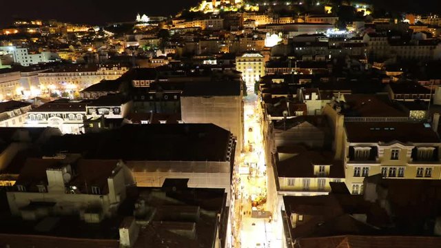 Aerial view of Lisbon downtown and Santa Justa Street to Sao Jorge Castle hill from panoramic platform of Elevador de Santa Justa or Miradouro de Santa Justa connecting Baixa to Igreja do Carmo.