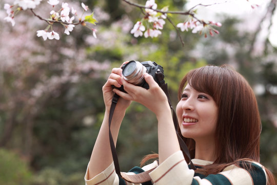 woman taking a picture with a camera