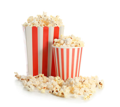 Paper box and cup with popcorn on white background