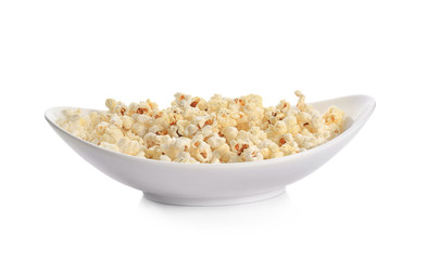 Plate with popcorn on white background