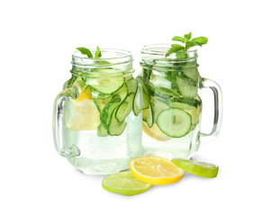 Fresh cucumber water with lemon and mint in mason jars, isolated on white