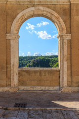 Panoramic view through a window in Sorano, an old town in Tuscany in Italy
