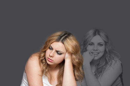 Double Exposure Of Long Haired Young Woman. Sad Woman In Front And The Same Woman Is Happy On The Gray Background.