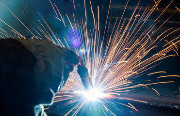 Industrial steel welder in factory technical,