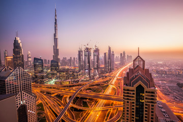 Fototapeta na wymiar Night cityscape of Dubai with modern futuristic architecture , United Arab Emirates