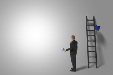 miniature figurine businessman character with ladder and blue paint in front of a bright lit wall