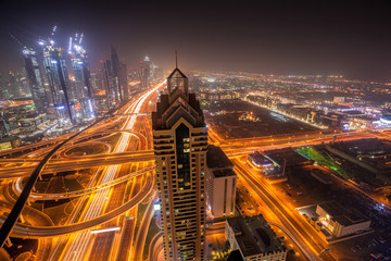 Obraz premium Night cityscape of Dubai with modern futuristic architecture , United Arab Emirates
