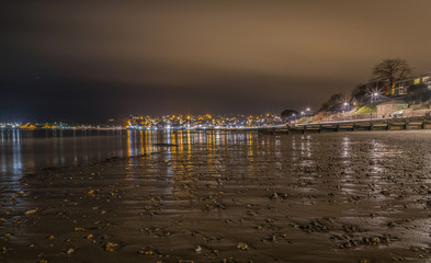 Town reflections on beach