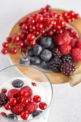 Yogurt with berries, cranberries and raspberries